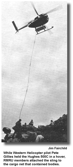 While Western Helicopter pilot Pete Gillies held the Hughes 500C in a hover, RMRU members attached the sling to the cargo net that contained bodies. (photo by Jim Fairchild)