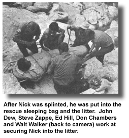 After Nick was splinted, he was put into the rescue sleeping bag and the litter. John Dew, Steve Zappe, Ed Hill, Don Chambers and Walt Walker (back to camera) work at securing Nick into the litter.
