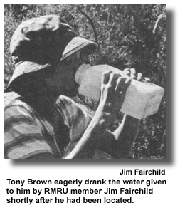 Tony Brown eagerly drank the water given to him by RMRU member Jim Fairchild shortly after he had been located. (photo by Jim Fairchild)