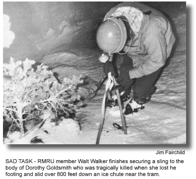 SAD TASK – RMRU member Walt Walker finishes securing a sling to the body of Dorothy Goldsmith who was tragically killed when she lost he footing and slid over 800 feet down an ice chute near the tram. (photo by Jim Fairchild)