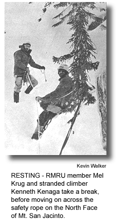 RESTI NG - RMRU member Mel Krug and stranded climber Kenneth Kenaga take a break, before moving on across the safety rope on the North Face of Mt. San Jacinto. (photo by Kevin Walker)