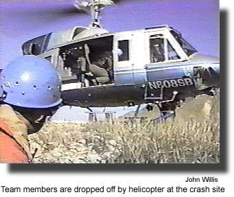 Team members are dropped off by helicopter at the crash site