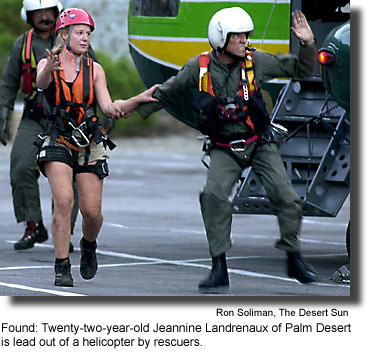 Found: Twenty-two-year-old Jeannine Landrenaux of Palm Desert is lead out of a helicopter by rescuers. (photo by Ron Soliman, The Desert Sun)