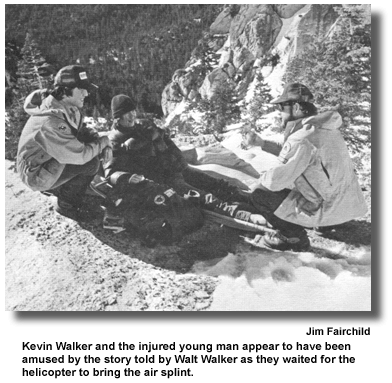 Kevin Walker and the injured young man appear to have been amused by the story told by Walt Walker as they waited for the helicopter to bring the air splint. (Photo by Jim Fairchild)