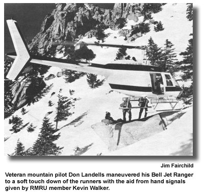 Veteran mountain pilot Don Landells maneuvered his Bell Jet Ranger to a soft touch down of the runners with the aid from hand signals given by RMRU member Kevin Walker. (photo by Jim Fairchild)