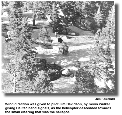 Wind direction was given to pilot Jim Davidson, by Kevin Walker giving Helitac hand signals, as the helicopter descended towards the small clearing that was the helispot. (photo by Jim Fairchild)