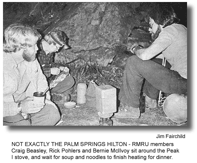 NOT EXACTLY THE PALM SPRINGS HILTON - RMRU members Craig Beasley, Rick Pohlers and Bernie McIlvoy sit around the Peak I stove, and wait for soup and noodles to finish heating for dinner. (photo by Jim Fairchild)