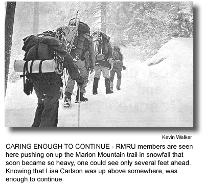 CARING ENOUGH TO CONTINUE - RMRU members are seen here pushing on up the Marion Mountain trail in snowfall that soon became so heavy, one could see only several feet ahead. Knowing that Lisa Carlson was up above somewhere, was enough to continue. (photo by Kevin Walker)