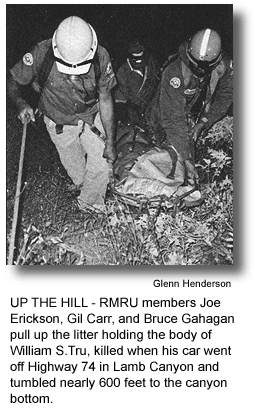 UP THE HILL - RMRU members Joe Erickson, Gil Carr, and Bruce Gahagan pull up the litter holding the body of William S.Tru, killed when his car went off Highway 74 in Lamb Canyon and tumbled nearly 600 feet to the canyon bottom.
