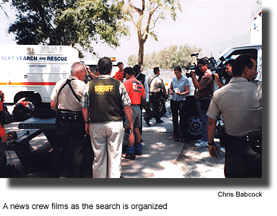 A news crew films as the search is organized. (photo by Chris Babcock)