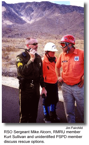 RSO Sergeant Mike Alcorn, RMRU member Kurt Sullivan and unidentified PSPD member  discuss rescue options. (photo by Jim Fairchild)