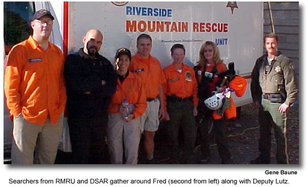 Searchers from RMRU and DSSAR gather around Fred (second from left) along with Deputy Lutz. (photo by Gene Baune)