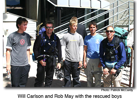 Will Carlson and Rob May with the rescued boys